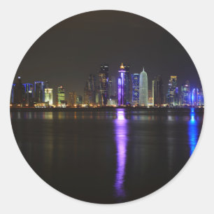 Skyline of Doha, Qatar at night round sticker