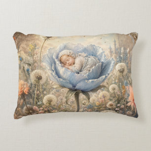 Sleeping baby in blue flower decorative cushion