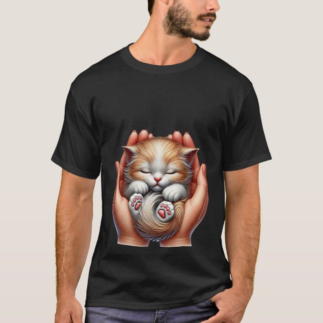 Sleeping Kitten Cradled in Hands Tiny Fluffy Cat  T-Shirt (Front)