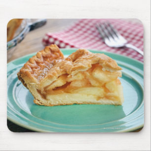 Slice of fresh baked apple pie on plate mouse mat