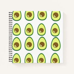Sliced green avocado on white notebook
