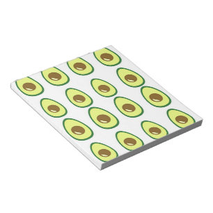 Sliced green avocado on white notepad