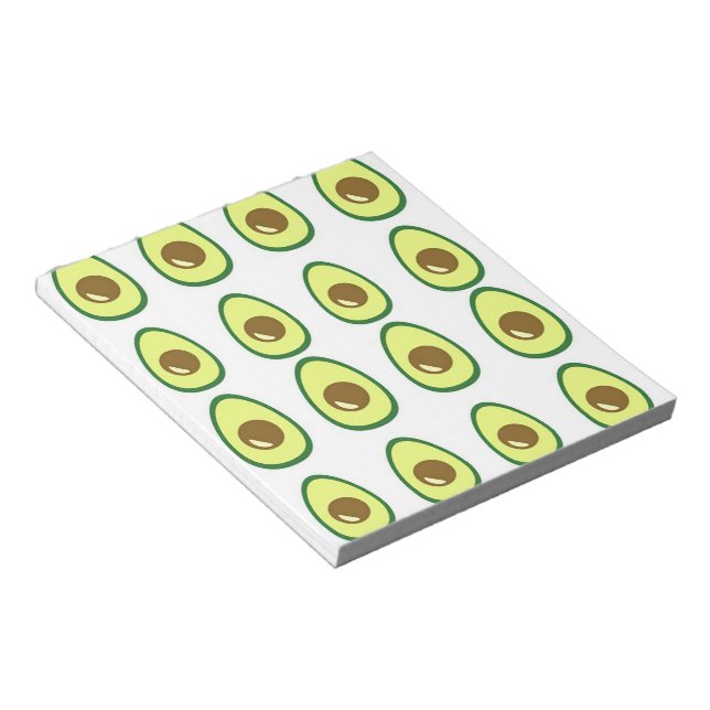 Sliced green avocado on white notepad (Angled)