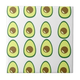 Sliced green avocado on white tile
