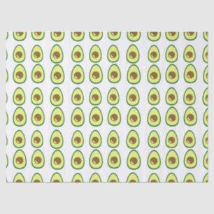 Sliced green avocado on white tissue paper