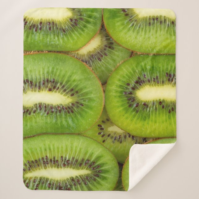 Slices of fresh and ripe kiwi fruit in rowsbrown,c sherpa blanket (Front)