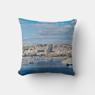 Sliema harbour with modern buildings and boats cushion