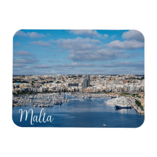 Sliema harbour with modern buildings and boats magnet