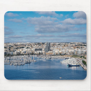 Sliema harbour with modern buildings and boats mouse mat