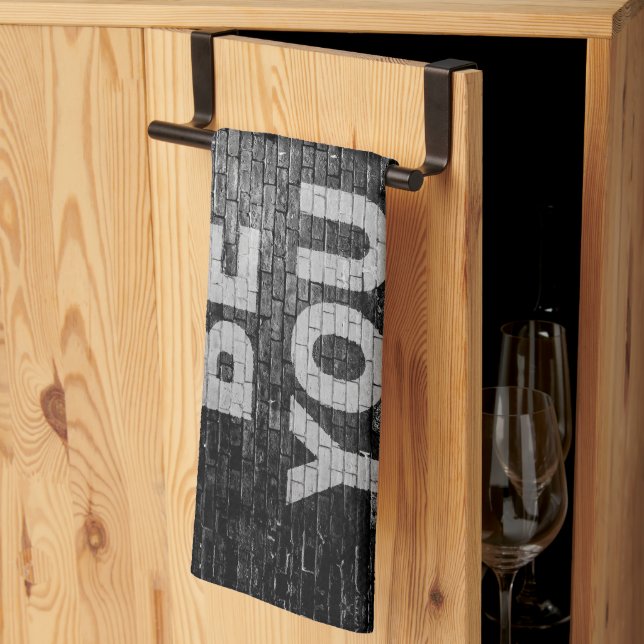 SlipperyJoe's Be You black brick wall walking figu Tea Towel (Thirds Fold)