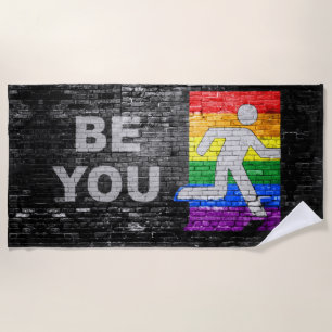 SlipperyJoe's Be You brick wall stick figure rainb Beach Towel