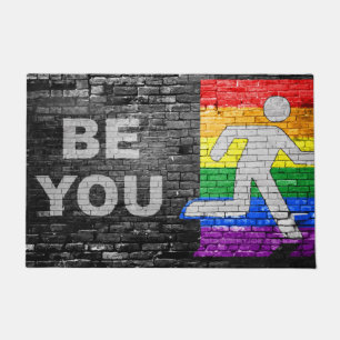 SlipperyJoe's Be You brick wall stick figure rainb Doormat