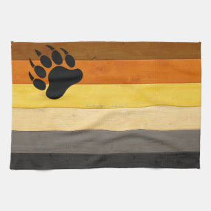 SlipperyJoe's Bear Pride flag wooden floor texture Tea Towel