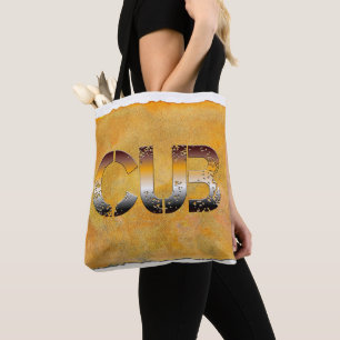 SlipperyJoe's cub bear words gold brown tan white Tote Bag