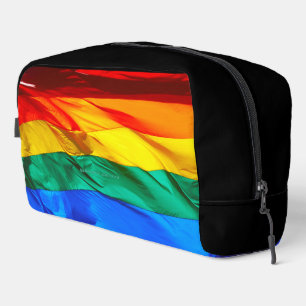 SlipperyJoe's gay pride flag waving red orange yel Dopp Kit
