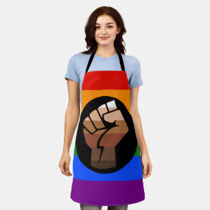SlipperyJoe's queer people colour flag raised fist Apron
