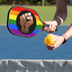 SlipperyJoe's queer people colour flag raised fist Pickleball Paddle