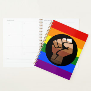 SlipperyJoe's queer people colour flag raised fist Planner