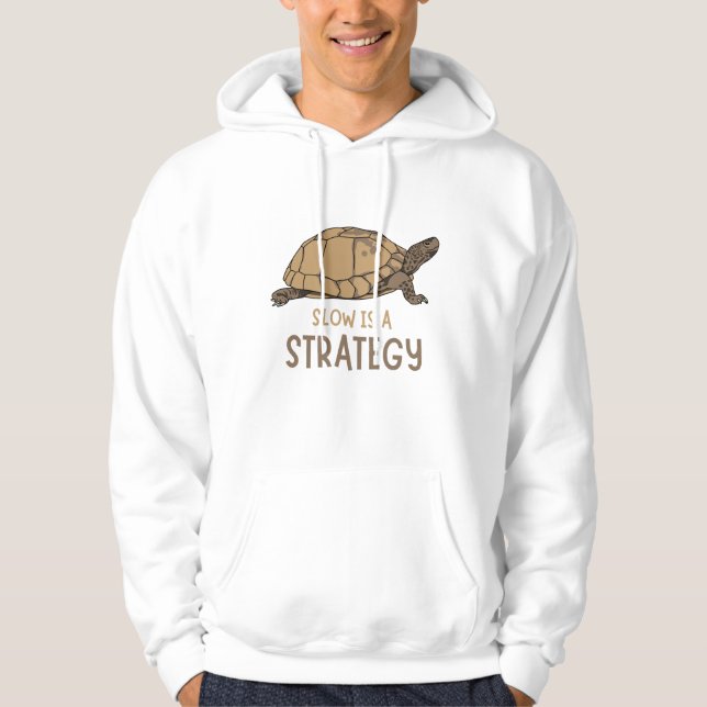 Slow Is a Strategy – Minimal Turtle Quote Design Hoodie (Front)