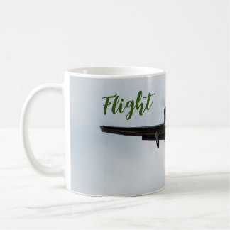 Small aircraft with flight time in green coffee mug