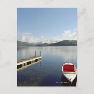 Small boat tied up on dock at Lake Placid Postcard