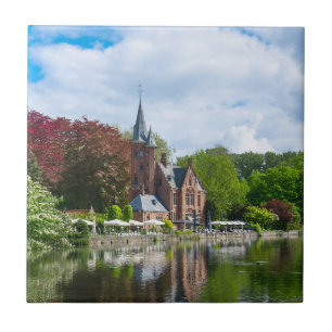 Small castle near lake in Bruges, Belgium Tile