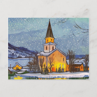 Small church in the village during winter holiday postcard