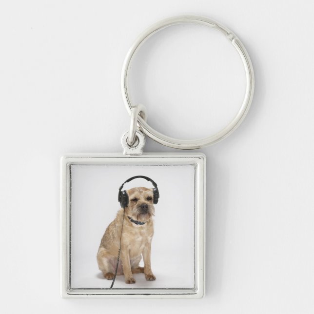 Small dog wearing headphones key ring (Front)