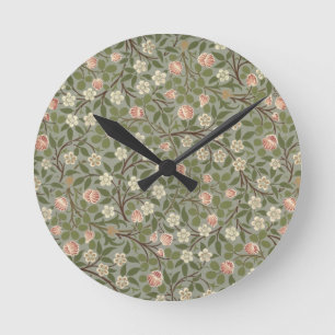 Small pink and white flower wallpaper design round clock