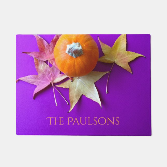 Small pumpkin with fall leaves on purple doormat (Front)