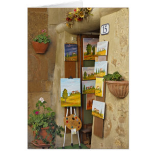 Small shope with artwork for sale on sidewalk