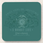 Small Steps, Big Adventures - A Hobbit Life Coaster<br><div class="desc">Channel your inner Hobbit with this cozy Lord of the Rings™ design inspired by the peaceful hills of the Shire™. Featuring a quaint Hobbit hole with its signature round door tucked into a lush, grassy hillside, the artwork is paired with the uplifting phrase, “Small Steps Big Adventures – A Hobbit...</div>