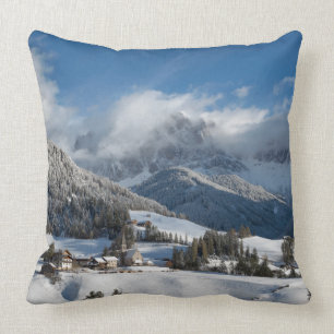 Small village with Dolomites mountains in the snow Cushion