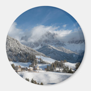 Small village with Dolomites mountains in the snow Magnet