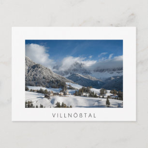 Small village with Dolomites mountains in the snow Postcard