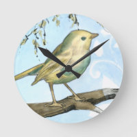 Small Yellow Bird Perched on a Branch Looking up