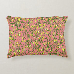 Small yellow flowers and branches on a pink backgr decorative cushion