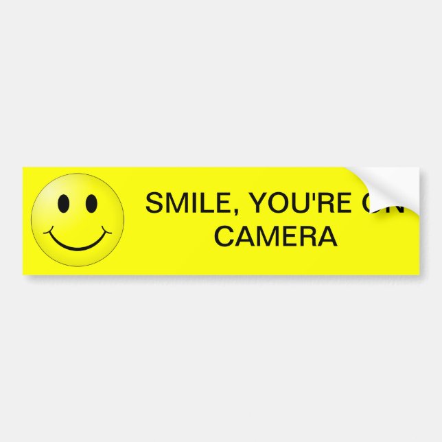 SMILE, YOU'RE ON CAMERA BUMPER STICKER (Front)