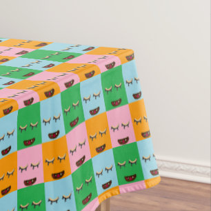 Smiling monster block faces tablecloth