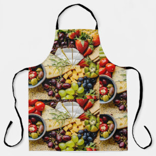 Snack board with cheese, fruits and crackers apron