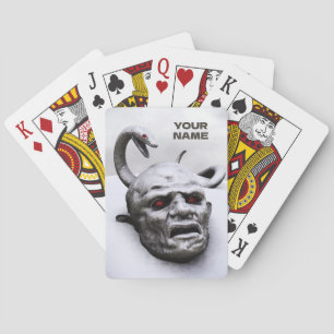 Snake above head sculpture playing cards