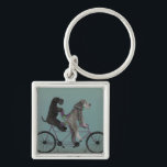 snorted tandem key ring<br><div class="desc">Gray tandem by Fabfunky. Features schnauzers riding a bicycle in a whimsical,  steampunk style. | 192047D</div>