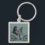snorted tandem key ring<br><div class="desc">Gray tandem by Fabfunky. Features schnauzers riding a bicycle in a whimsical,  steampunk style. | 192047D</div>