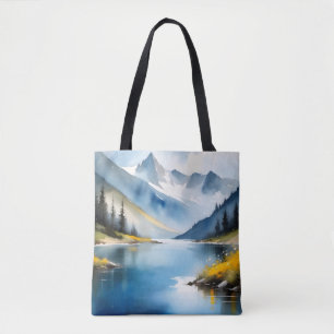 Snow capped mountains and a lake tote bag