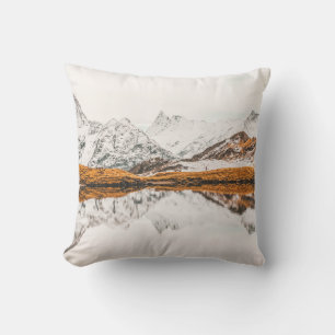 SNOW-CAPPED ROCKY MOUNTAIN UNDER CLOUDY SKY DURING CUSHION