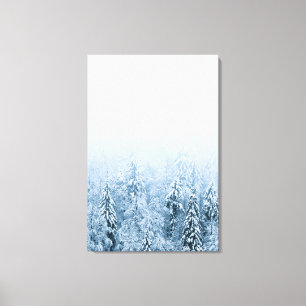 Snow covered beech spruce forest in fog canvas print