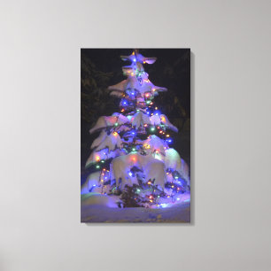 Snow Covered Brightly Lit Christmas Tree Canvas Print
