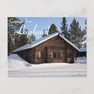 Snow-covered log cabin in Lapland text postcard