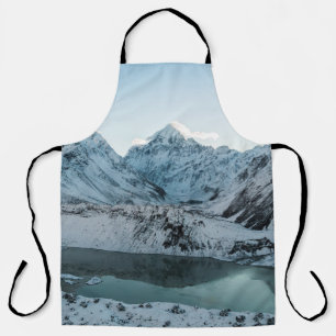 SNOW COVERED MOUNTAIN NEAR BODY OF WATER APRON