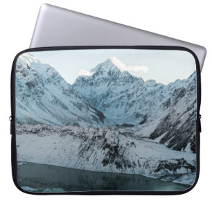 SNOW COVERED MOUNTAIN NEAR BODY OF WATER LAPTOP SLEEVE